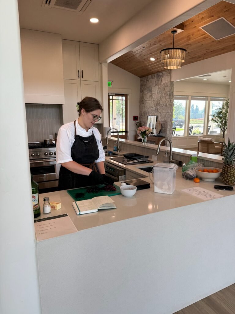 Chef preparing fresh ingredients in The Ponderosa Estate community kitchen
