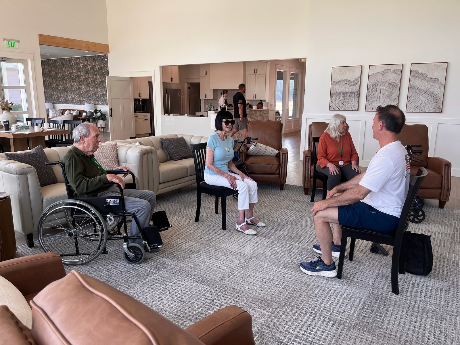 Residents visiting together in the common living area at The Ponderosa Estate