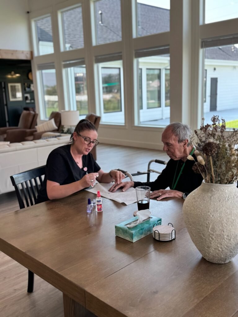 A caregiver offering one-on-one grief support in assisted living to a Resident at The Ponderosa Estate.
