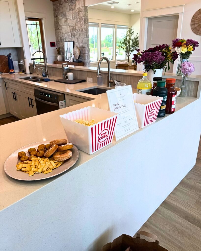 Movie night snack bar at The Ponderosa Estate common area, with popcorn and treats set out for Residents